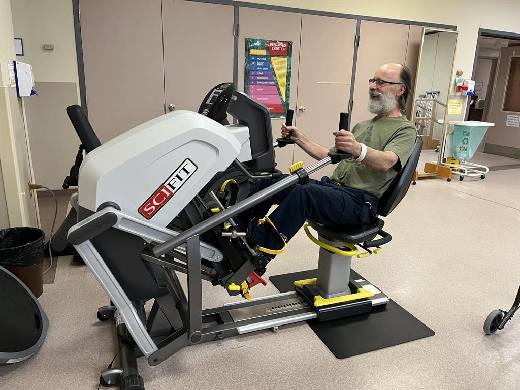 patient using a recumbent stepper